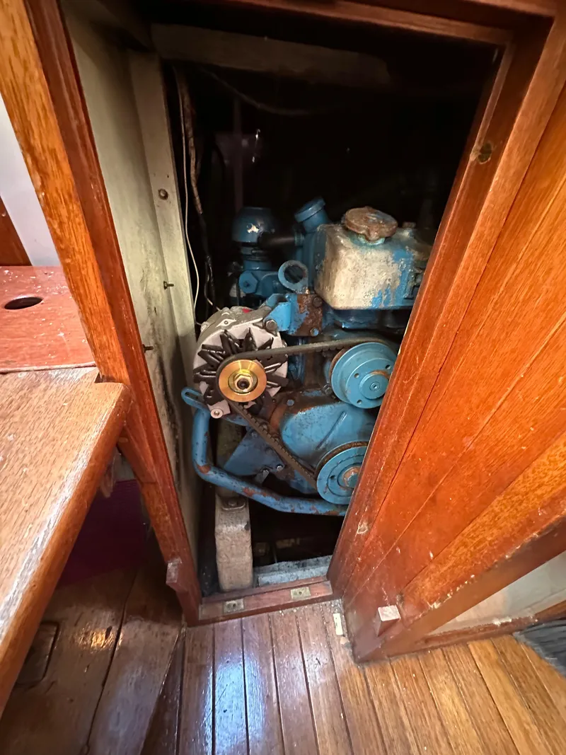 Slide: The Image of Engine compartment of a 1972 Mariner 31 Ketch, showcasing vintage marine machinery. - 19