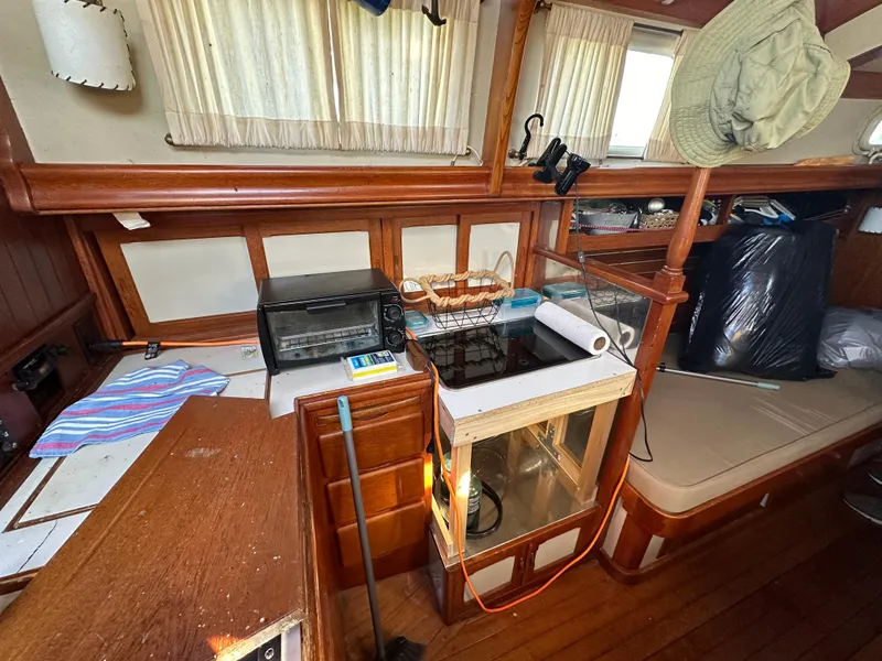Slide: The Image of Interior of 1972 Mariner 31 Ketch with wooden furnishings and nautical equipment. - 24