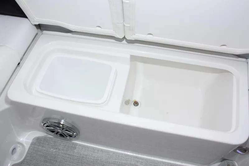 Slide: The Image of 2024 Formula 270 Bowrider storage compartment with integrated speaker. - 14