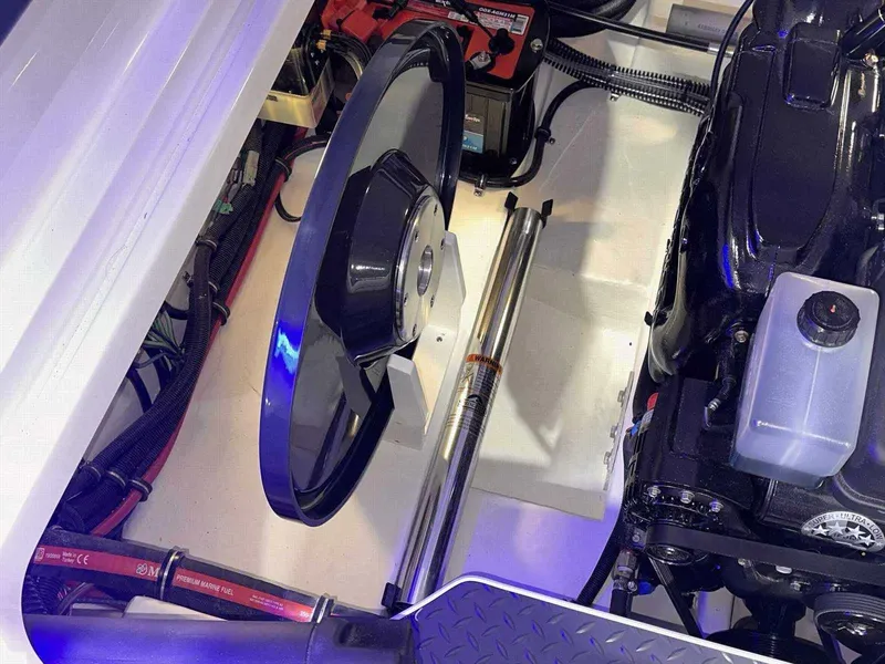 Slide: The Image of 2024 Formula 270 Bowrider engine compartment with steering mechanism and battery. - 16