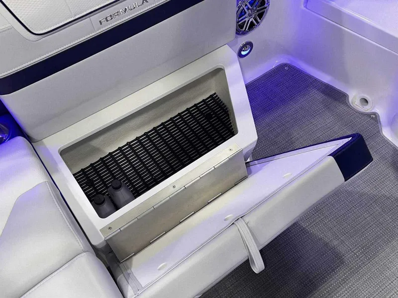 Slide: The Image of 2024 Formula 270 Bowrider interior with open storage compartment and modern seating. - 19
