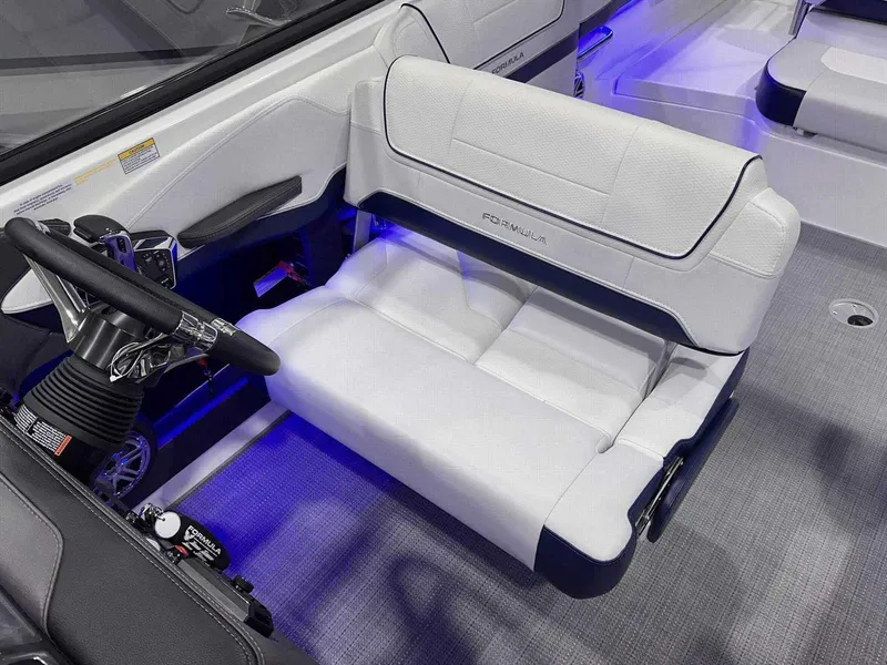 Slide: The Image of 2024 Formula 270 Bowrider interior with white seating and modern steering wheel. - 20