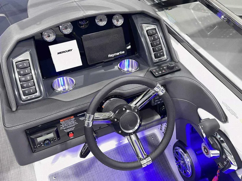 Slide: The Image of 2024 Formula 270 Bowrider dashboard with modern controls and steering wheel. - 23