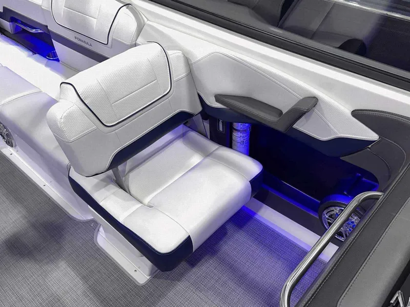 Slide: The Image of 2024 Formula 270 Bowrider interior with white leather seating and blue LED lighting. - 24