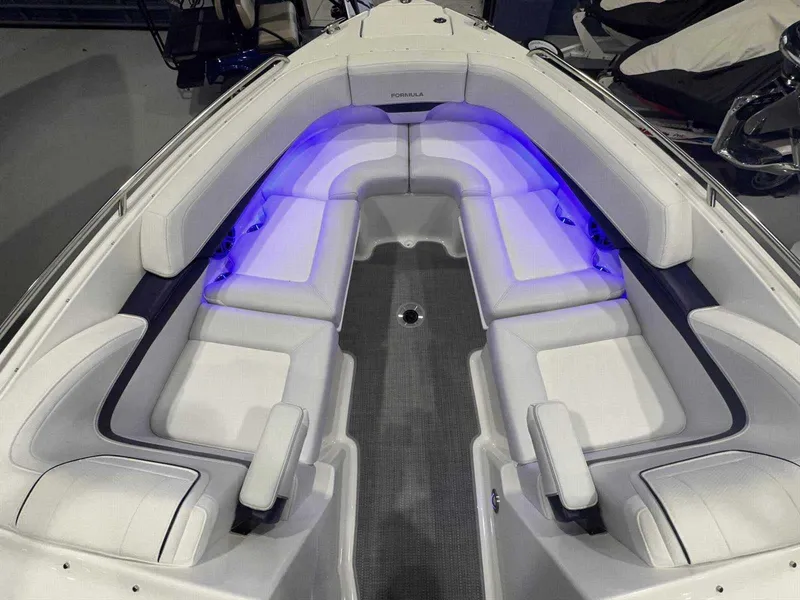 Slide: The Image of 2024 Formula 270 Bowrider interior with white seating and blue LED lighting. - 31
