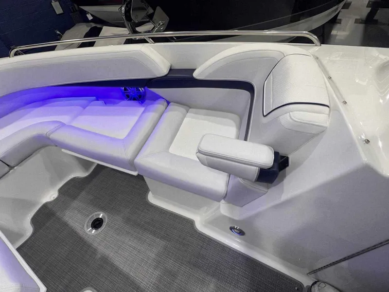 Slide: The Image of 2024 Formula 270 Bowrider interior with white seating and blue LED lighting. - 32