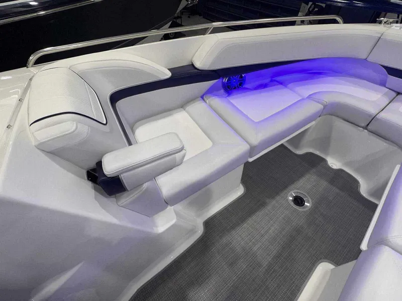 Slide: The Image of 2024 Formula 270 Bowrider interior with sleek seating and ambient blue lighting. - 34