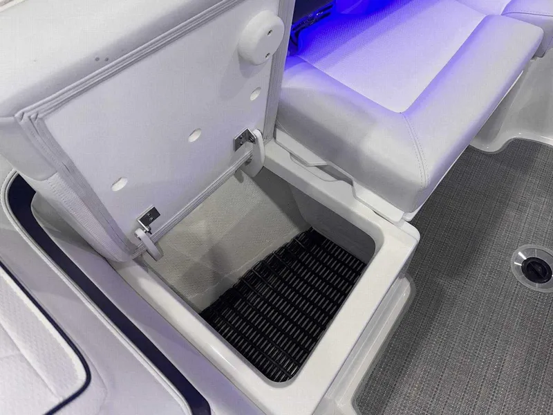 Slide: The Image of 2024 Formula 270 Bowrider storage compartment with cushioned seating and blue LED lighting. - 35