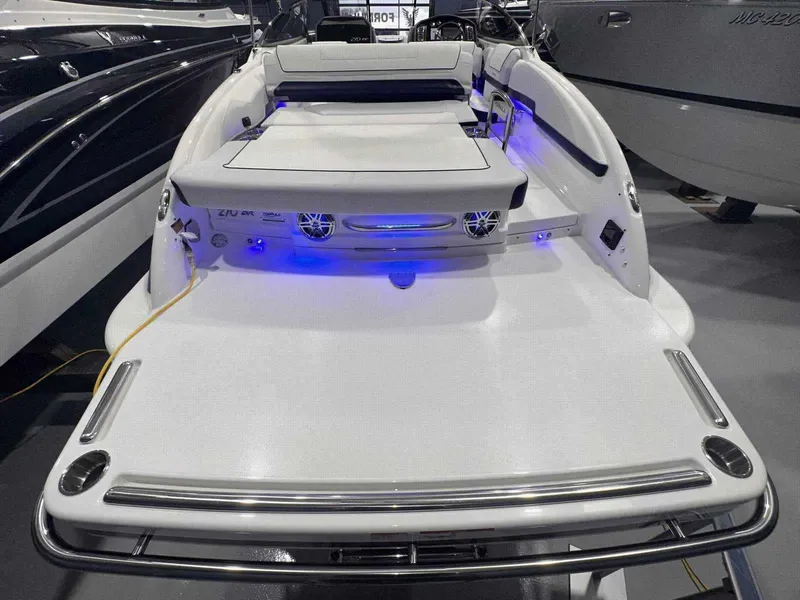 Slide: The Image of 2024 Formula 270 Bowrider boat with sleek design and blue LED lights. - 5