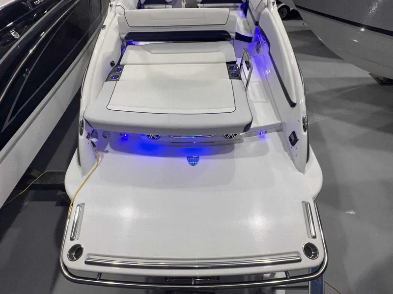 Slide: The Image of 2024 Formula 270 Bowrider boat with sleek design and blue LED lighting. - 7