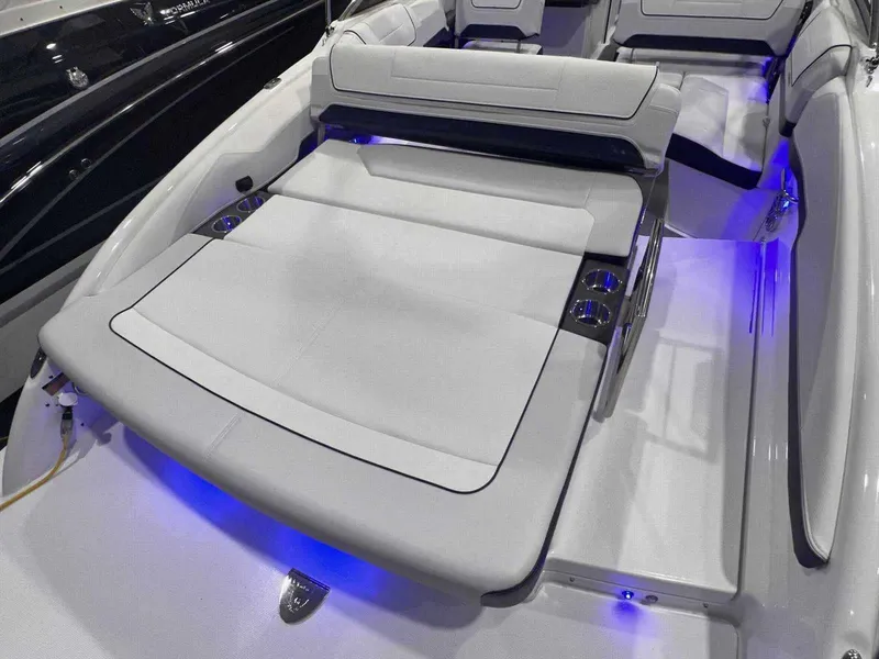 Slide: The Image of 2024 Formula 270 Bowrider with luxurious seating and ambient blue lighting. - 9