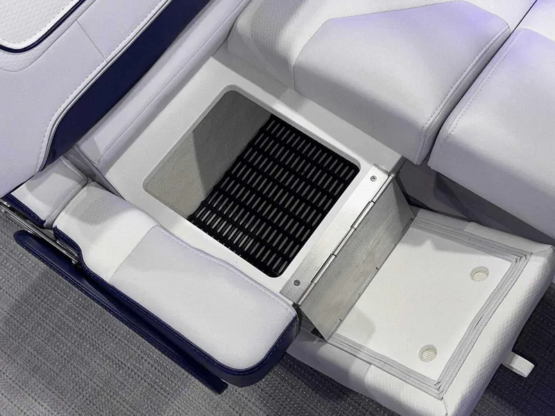 Slide: The Image of 2024 Formula 270 Bowrider interior storage compartment with white cushioned seating. - 18