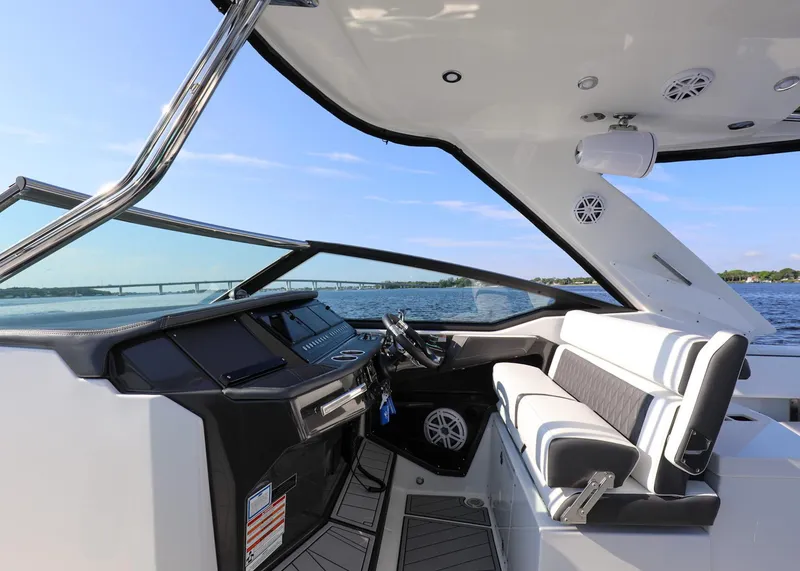 Slide: The Image of 2023 Monterey 385 Super Sport boat interior with sleek design and modern dashboard. - 19