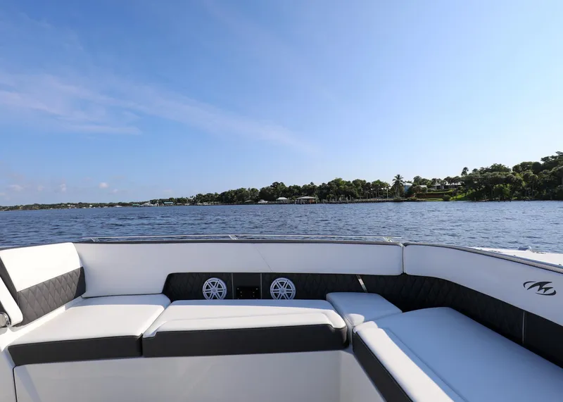 Slide: The Image of 2023 Monterey 385 Super Sport boat interior with lake view and clear sky. - 28