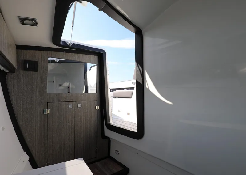 Slide: The Image of Interior of 2023 Monterey 385 Super Sport boat, featuring sleek design and modern finishes. - 35