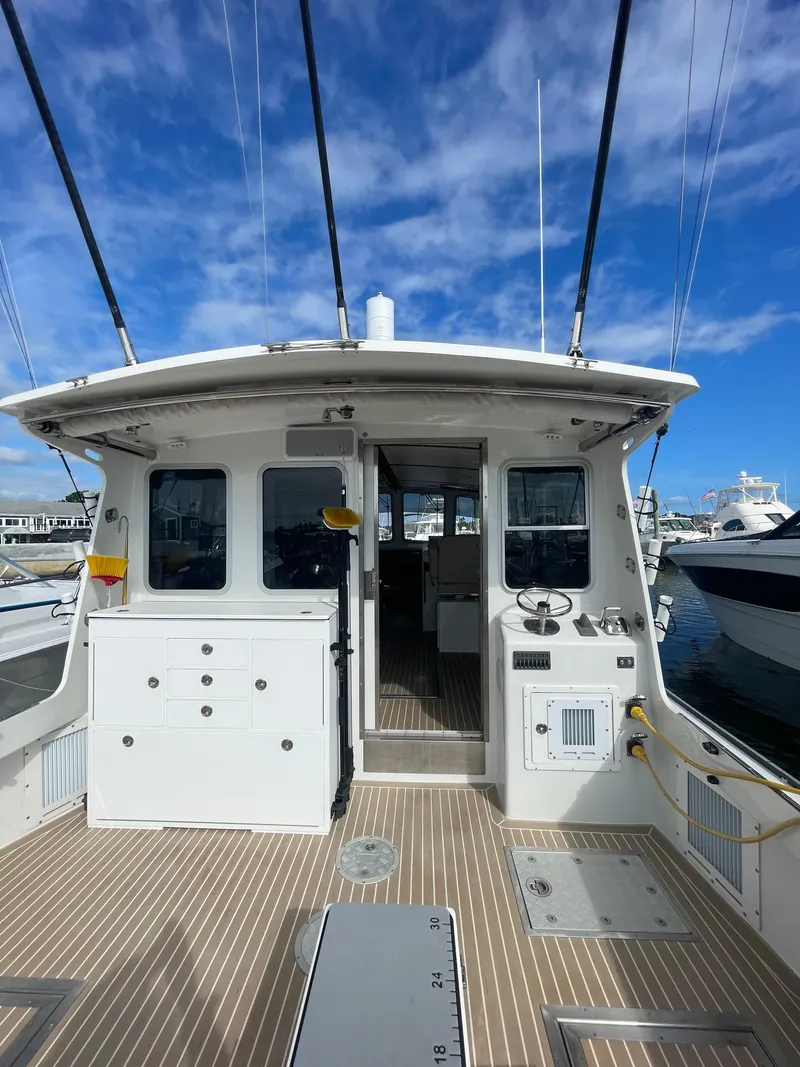 Slide: The Image of Wide open cockpit with cockpit helm station and custom tackle station - 11