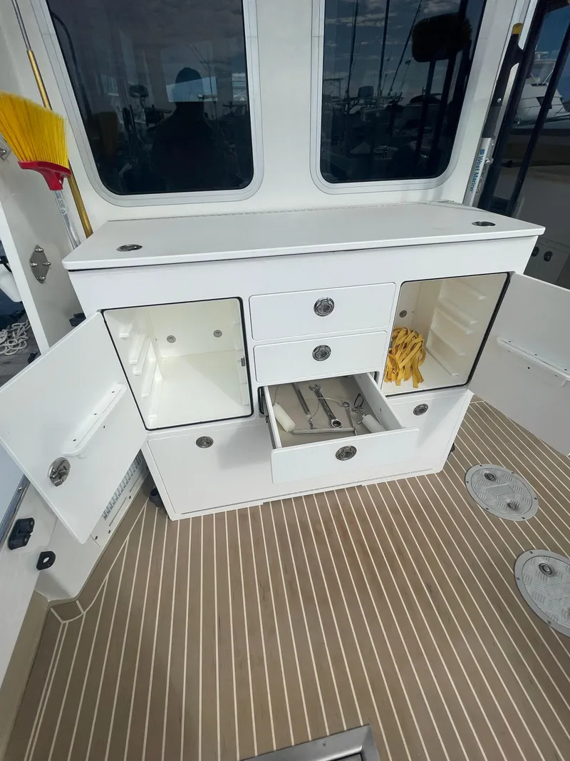 Slide: The Image of Large Cockpit with custom tackle storage - 13