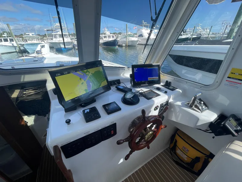 Slide: The Image of Dual Garmins with Easy dock bow and stern thrusters,auot pilot and Humphrey stabilization controls - 23