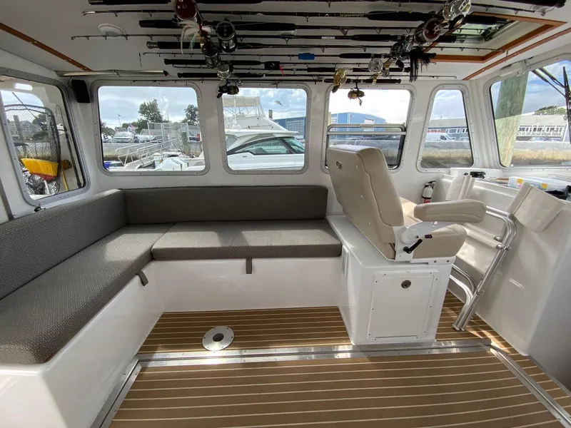 Slide: The Image of Spacious interior salon seating with ceiling rod storage - 30