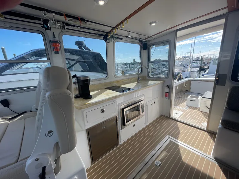 Slide: The Image of Spacious galley with induction stove, refrigerator, sink and microwave - 33