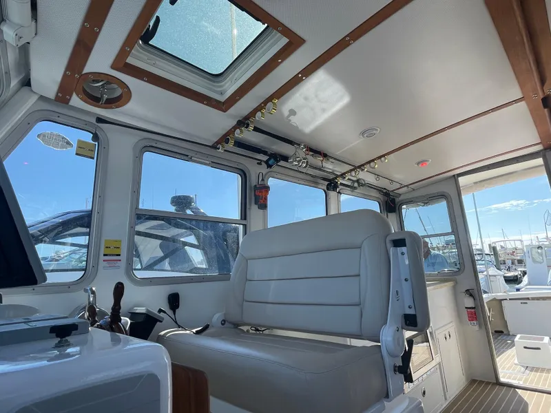 Slide: The Image of Interior of a 2021 Northern Bay 38 boat, featuring a spacious cabin with seating. - 34