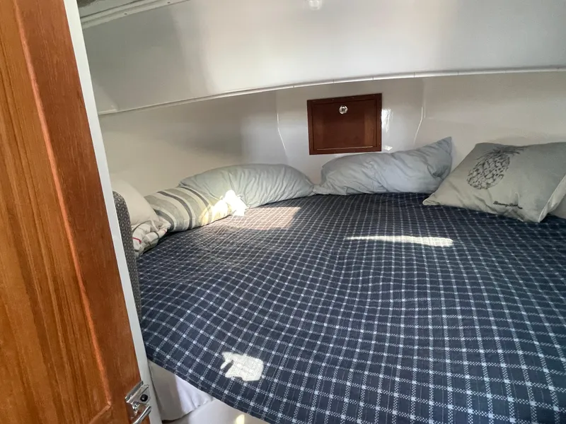 Slide: The Image of Cozy master stateroom with storage below. - 37
