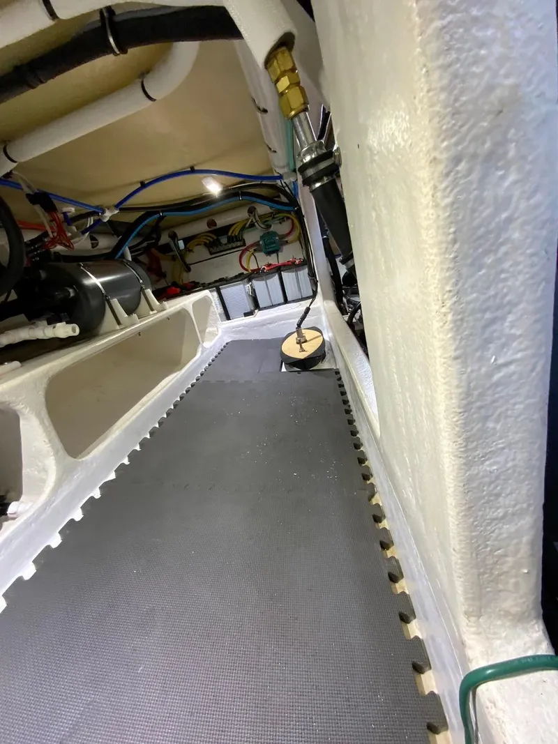 Slide: The Image of Starboard side below deck access showing batteries and hot water heater - 46