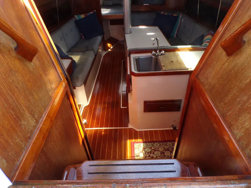 Slide: The Image of Interior of 1991 Catalina 34 sailboat with wood finish and cozy seating area. - 10