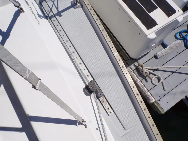Slide: The Image of Deck view of a 1991 Catalina 34 sailboat, featuring rigging and hardware. - 28