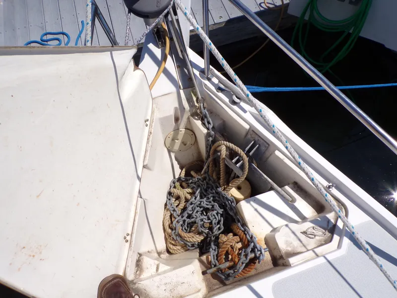 Slide: The Image of Anchor and ropes on 1991 Catalina 34 sailboat deck. - 29