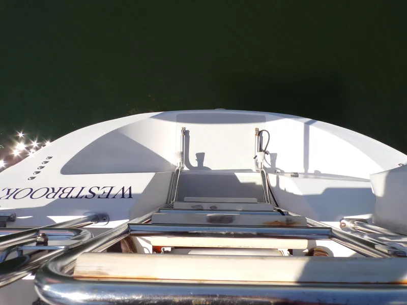 Slide: The Image of 1991 Catalina 34 yacht stern view with ladder and water reflection. - 7