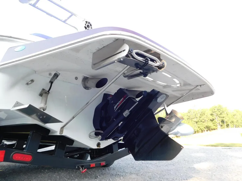 Slide: The Image of Rear view of a 2002 Baja 212 Islander boat on a trailer. - 13