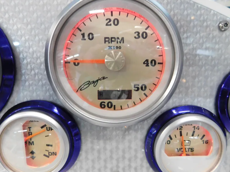 Slide: The Image of Close-up of 2002 Baja 212 Islander boat gauges, featuring RPM and voltage indicators. - 5