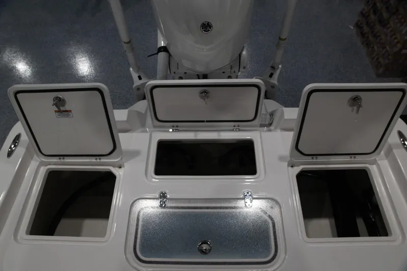 Slide: The Image of 2024 Contender 23 Bay boat storage compartments and hatches. - 5