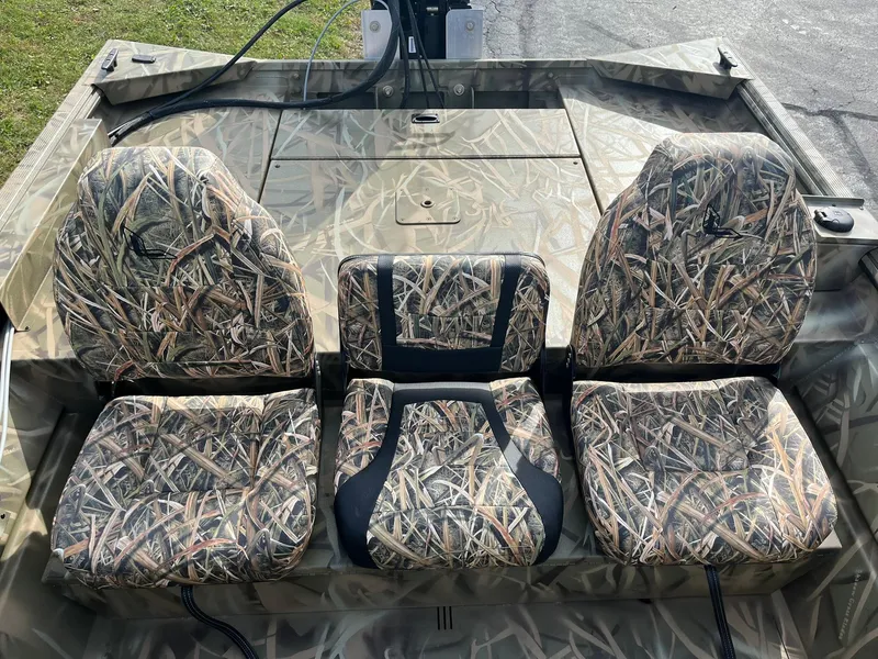 Slide: The Image of 2025 Lowe Roughneck 1760SC boat seats with camouflage pattern. - 12