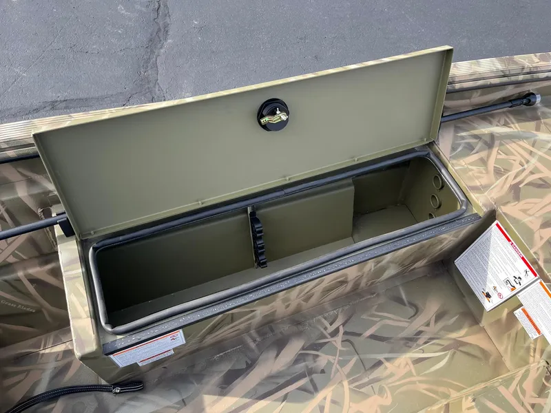 Slide: The Image of 2025 Lowe Roughneck 1760SC storage compartment with camouflage design. - 18