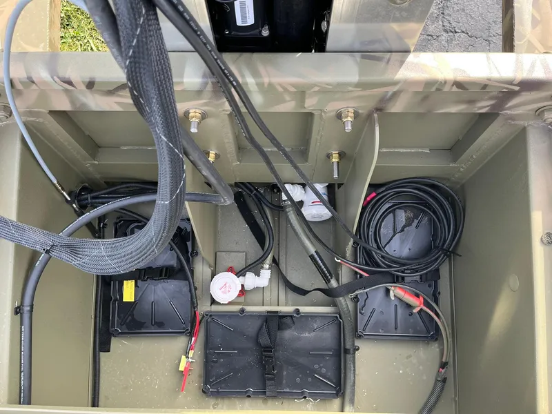 Slide: The Image of 2025 Lowe Roughneck 1760SC boat wiring and battery compartment. - 19
