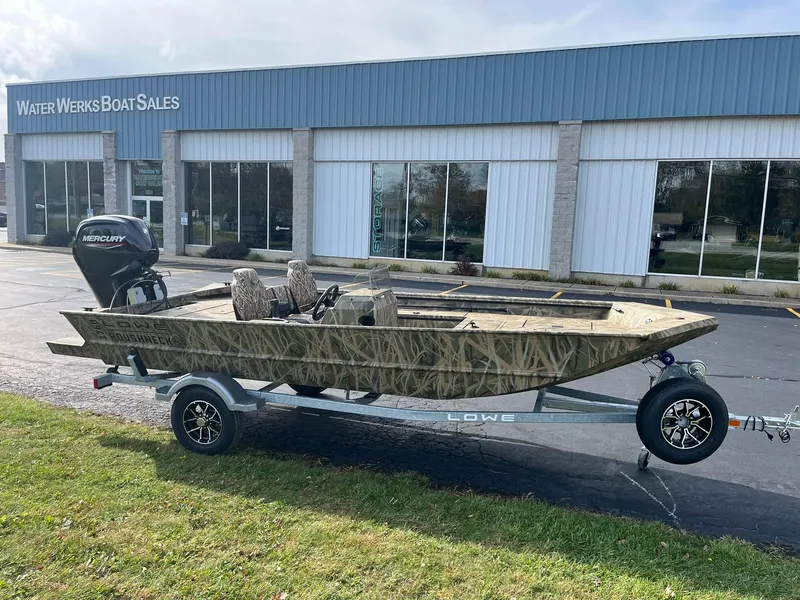 Slide: The Image of 2025 Lowe Roughneck 1760SC boat on trailer outside Water Werks Boat Sales. - 2