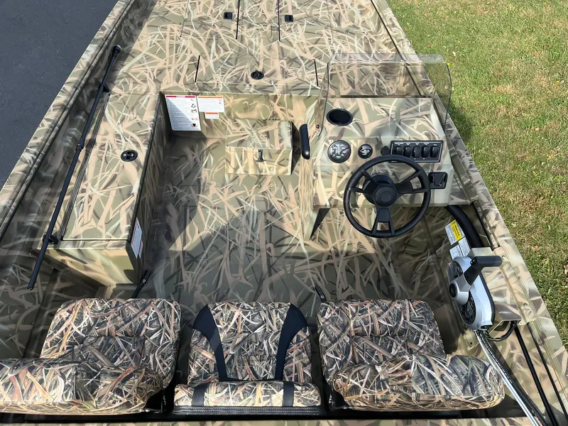 Slide: The Image of 2025 Lowe Roughneck 1760SC boat with camouflage design and seating. - 7