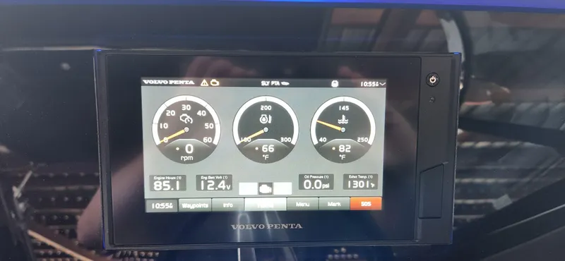 Slide: The Image of Volvo Penta display on 2021 Regal LS6 Surf boat dashboard showing engine metrics. - 17