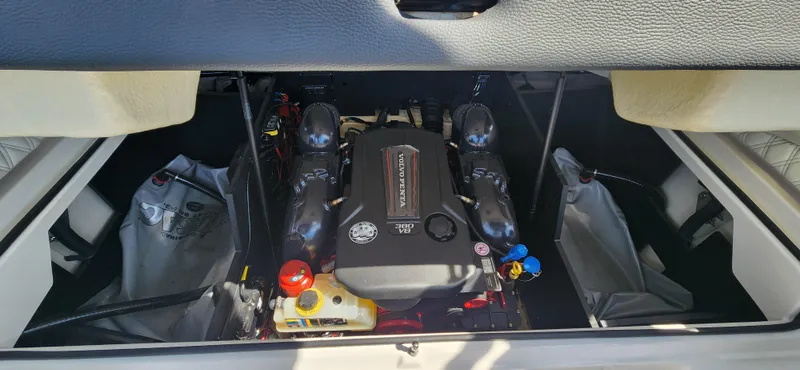 Slide: The Image of 2021 Regal LS6 Surf engine compartment with visible components and storage. - 20