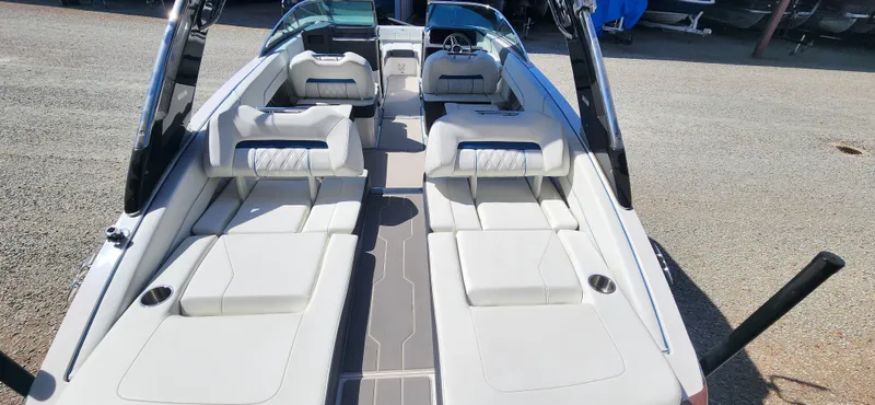 Slide: The Image of 2021 Regal LS6 Surf boat interior with spacious seating and modern design. - 5