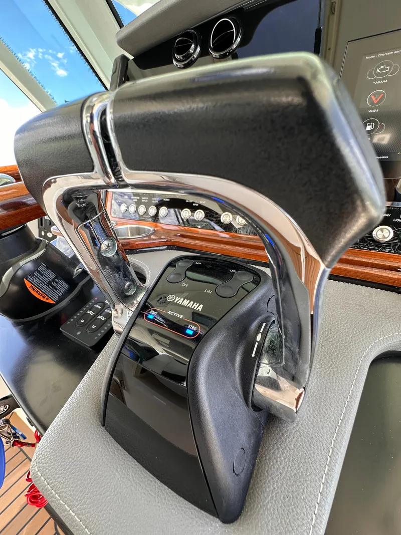 Slide: The Image of Close-up of 2021 Tiara Sport 34 LS boat throttle controls. - 13