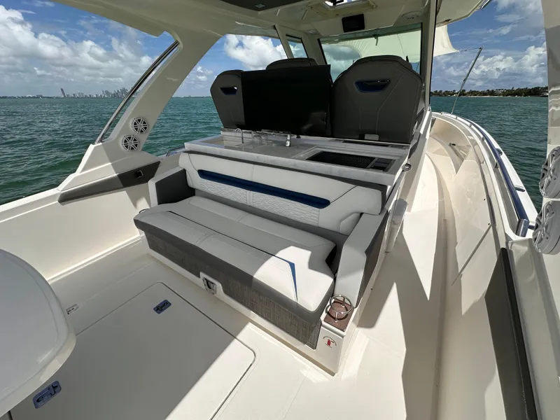Slide: The Image of 2021 Tiara Sport 34 LS boat interior with seating and ocean view. - 18