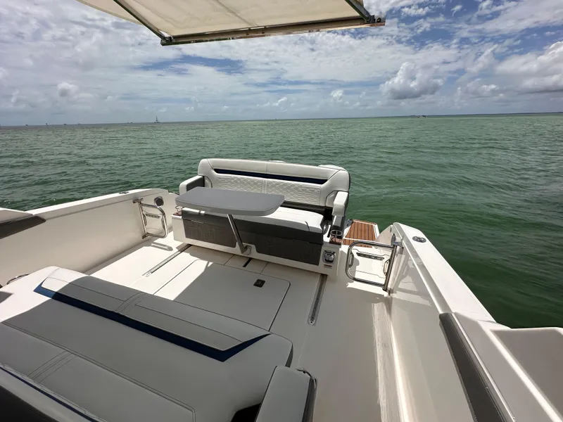 Slide: The Image of 2021 Tiara Sport 34 LS boat interior with ocean view and seating area. - 23