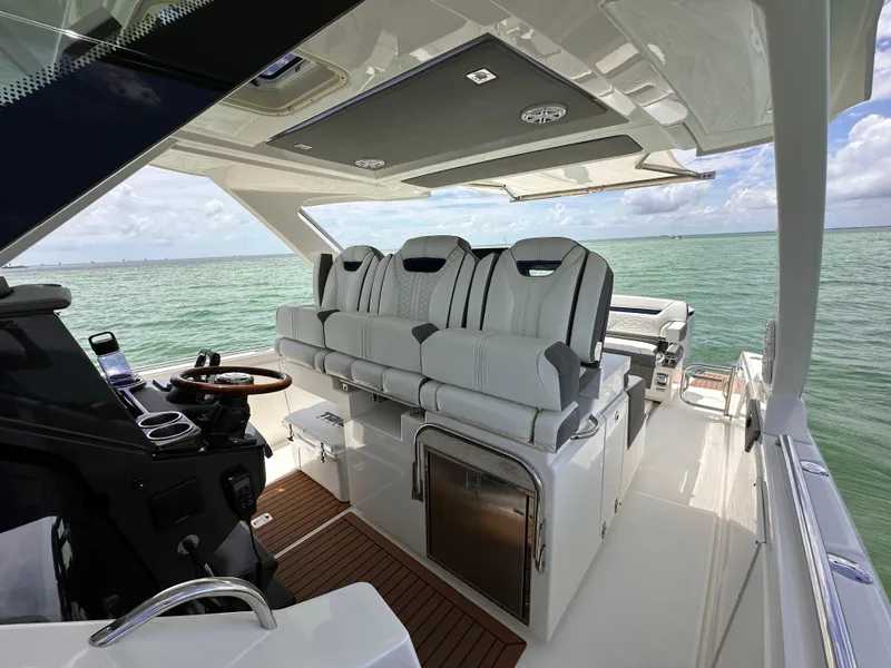 Slide: The Image of 2021 Tiara Sport 34 LS boat interior with luxurious seating and ocean view. - 25