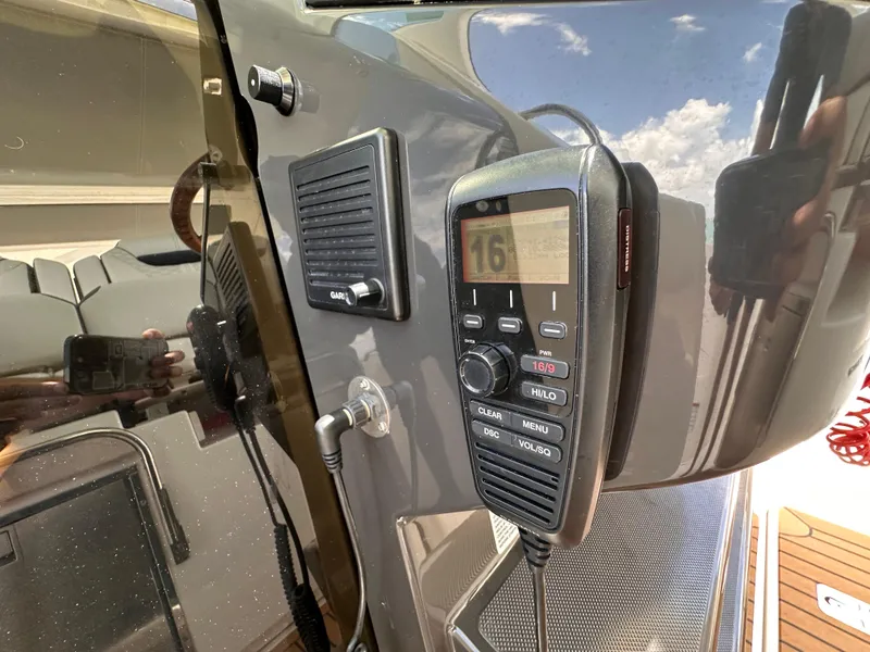 Slide: The Image of Close-up of a 2021 Tiara Sport 34 LS boat's communication system with a mounted radio. - 26