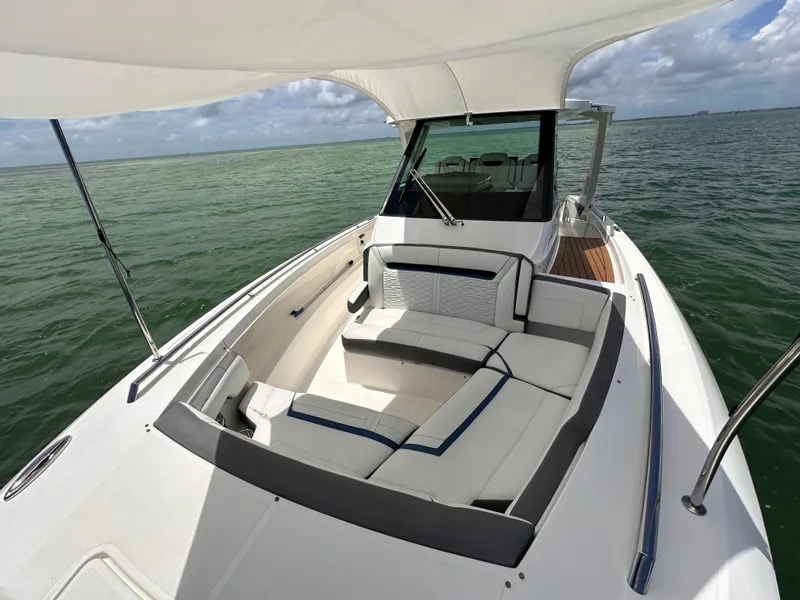Slide: The Image of 2021 Tiara Sport 34 LS boat with spacious seating on calm waters. - 8