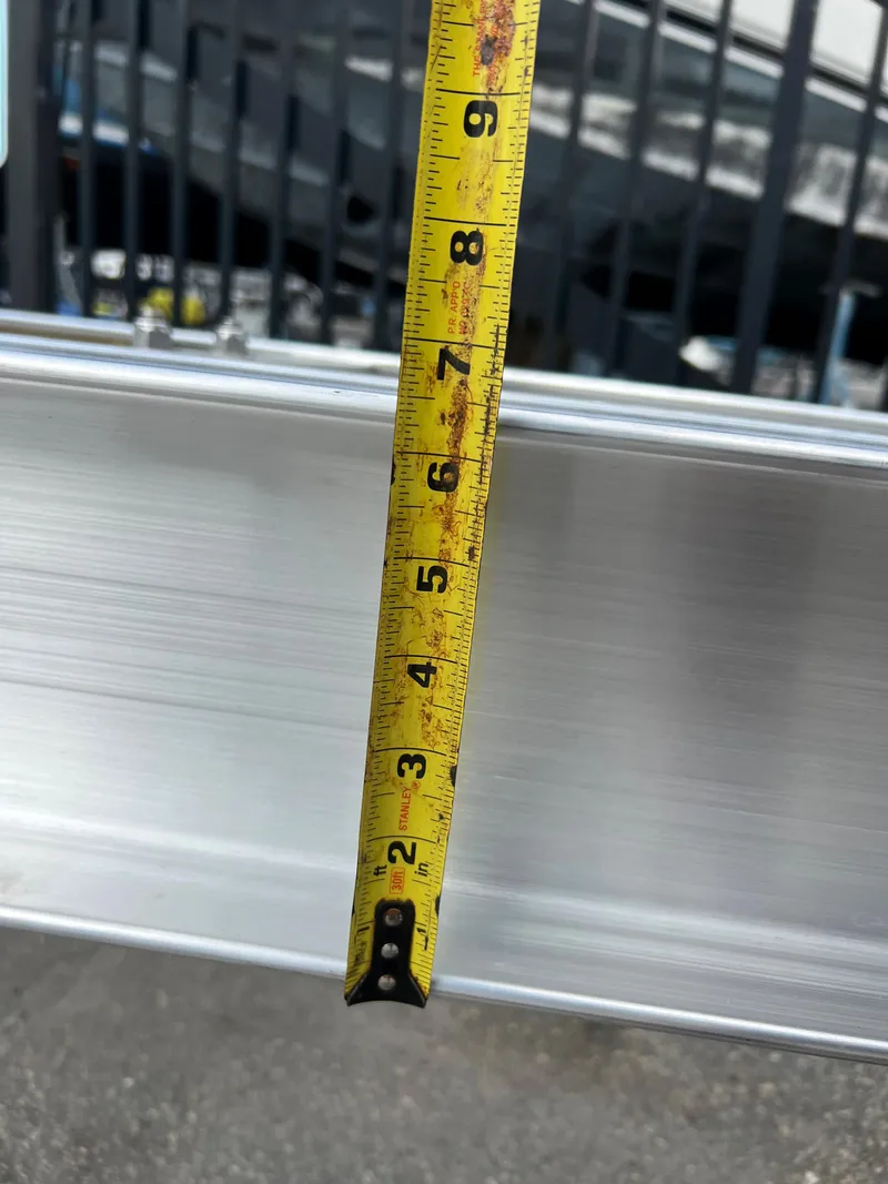 Slide: The Image of Measuring tape against 2024 trailer model, showing precise dimensions. - 6