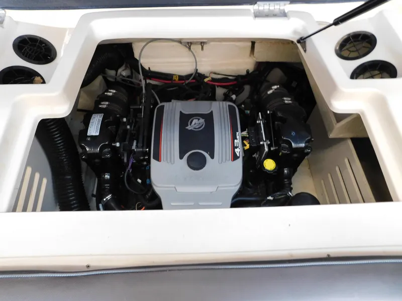 Slide: The Image of Engine compartment of a 2015 Sea Ray 19 SPX boat, showcasing the 4.3L engine. - 13
